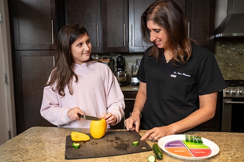 1773351151_silver-spring-pediatric-weight-management-mother-child-veggies-2 Pediatric Weight Management by Dr. Tara Altepeter, an obesity medicine specialist with Alega Health, a medical weight loss practice for adult, teen, and pediatric patients in the Silver Spring, MD community.